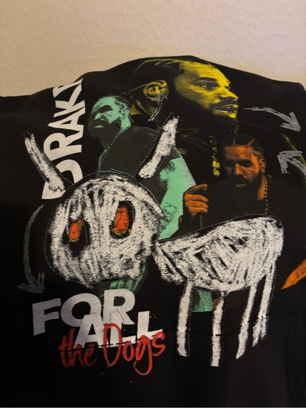 Drake For All the Dogs tour Hoodie with graphic of a skull with orange eyes